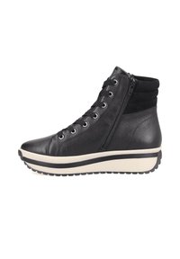 Black leather ankle boots with a textured finish, featuring a side zipper, lace-up front, and a cream-colored platform sole with black accents.