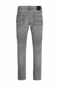 Jeans en denim gris avec une coupe slim, cinq poches et des détails de couture subtils. Le tissu a une texture lisse et une légère élasticité.