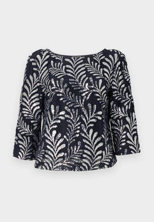 Navy blaues Shirt mit Pailletten und floralem Muster, mit Dreiviertelärmel und rundem Halsausschnitt, aus einem strukturierten Stoff gefertigt.