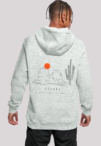 Gray hoodie featuring a back design with a landscape, cactus, and a red sun. Made from a soft, textured fabric with a drawstring hood.