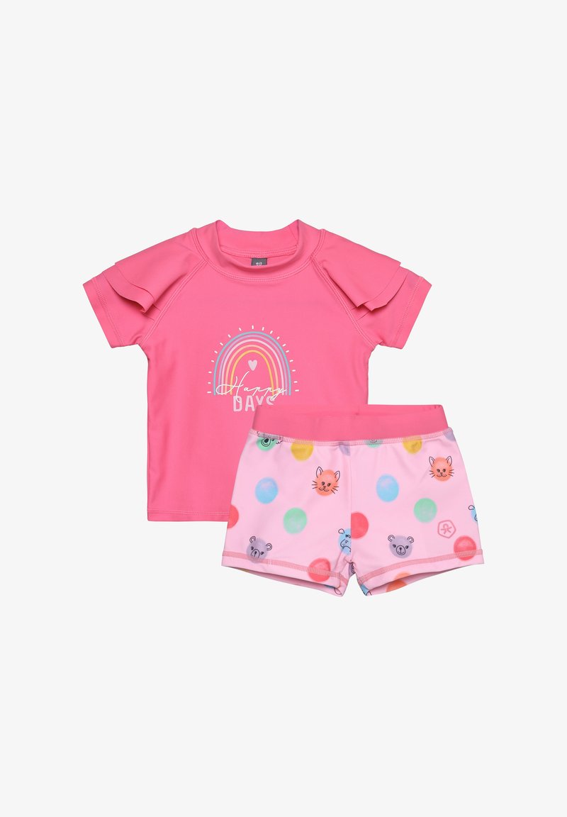 Haut rose à manches courtes avec arc-en-ciel et texte "Journée Heureuse", accompagné d'un short rose orné de pois colorés et de têtes d'animaux.