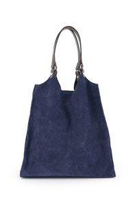 Marineblå mokkabags med rummelig form, glat tekstur og brune læderhåndtag med metalhardware-detaljer.