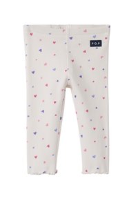 Ribbet leggings i creme med et spredt mønster af lyserøde og lilla hjerter. Elastisk talje med et lille mærkeskilt på siden.