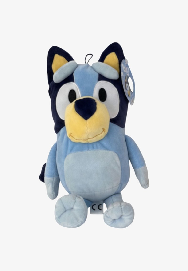 Blauwe pluche speelgoed dat lijkt op een cartoonhond. Zachte textuur, grote ogen, gele snuit, marineblauwe accenten op de oren en de rug. Hangtag bevestigd.