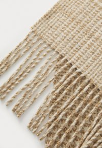 Woven scarf in beige with brown accents; features a textured pattern and fringed edges. Made from soft fabric.