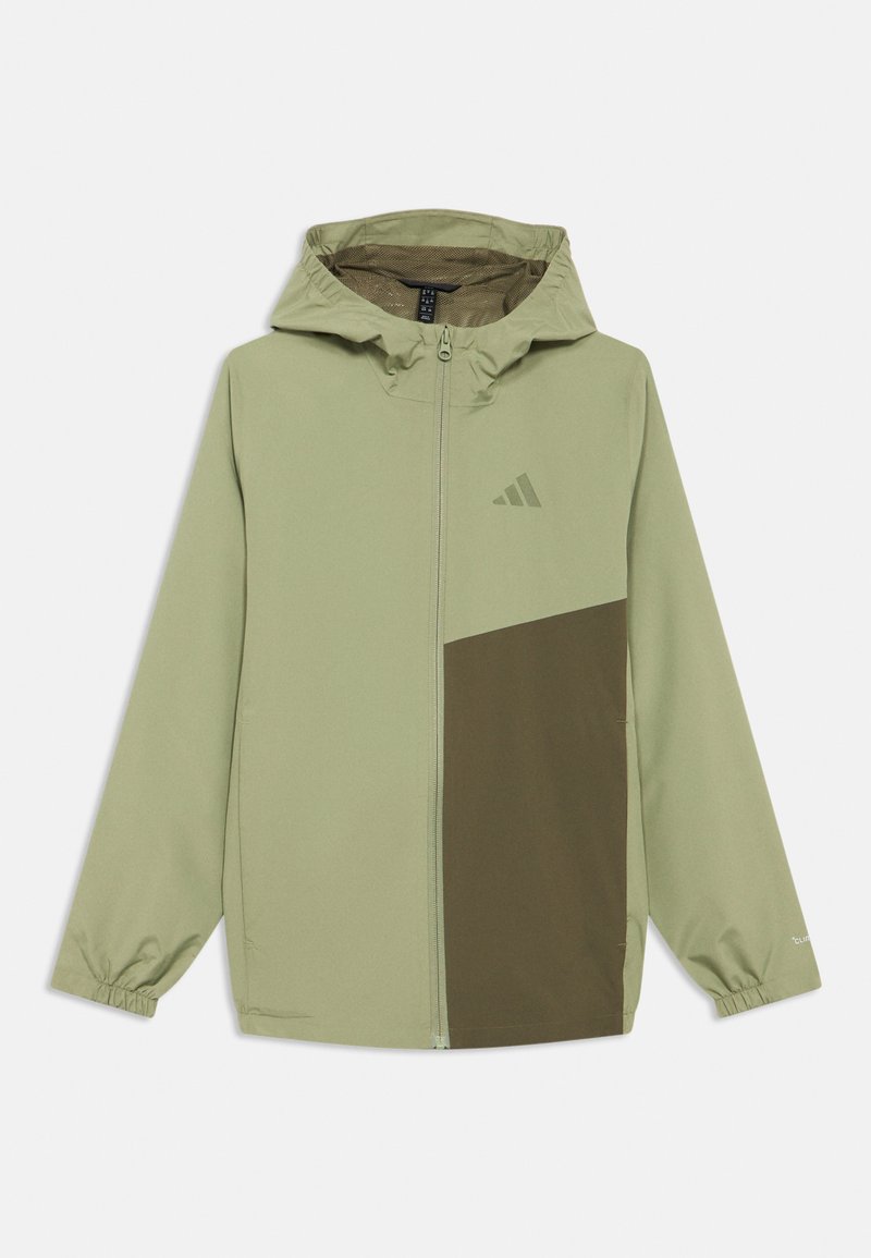 Φωτεινό πράσινο μπουφάν με κουκούλα και ελιάς πράσινο πάνελ. Διαθέτει κλείσιμο με φερμουάρ και ελαστικές μανσέτες. Κατασκευασμένο από λείο, ελαφρύ υλικό.