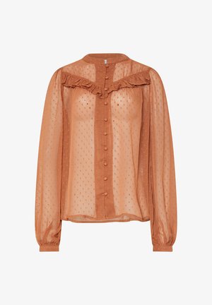 Blouse à manches longues en tissu transparent couleur rouille avec un empiècement froncé, une fermeture à boutons et un motif de pois texturé sur l'ensemble.