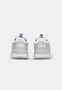 Fila sneakers in gray and white. Mesh and suede upper, round toe, cushioned sole, back pull tab. Logo displayed on heel.