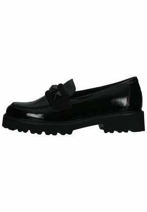 Black patent leather loafers with a suede band and pyramid stud detail, featuring a chunky rubber sole with prominent tread.