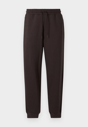 Dark brown sweatpants made from soft fabric. Features an elastic waistband with a drawstring, tapered legs, and ribbed cuffs at the ankles.
