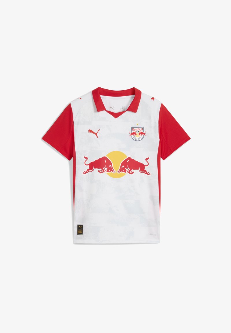 Červený a biely futbalový dres s výstrihom do V, krátkymi rukávmi a grafickým vzorom. Zobrazuje logo Red Bull a branding Puma.