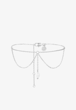 Delicate silver chain bracelet with a small clasp, a smiling sun charm, and a central white pearl hanging from the chain.