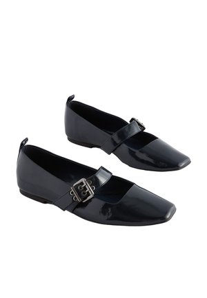 Black patent leather flats with a square toe design. Features a wide strap with a silver buckle. Smooth texture, low heel.