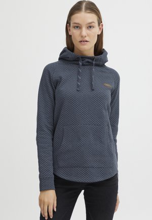 Hoodie bleu marine en tissu doux, avec un motif à pois, des cordons de serrage, une poche kangourou et un ourlet arrondi.