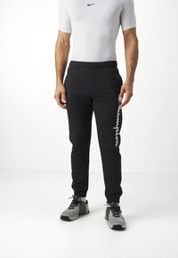 Champion ICONS CUFF PANTS LARGE LOGO - Pantalones deportivos - black
