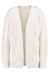 Vit kofta gjord av texturerad stickad tyg. Har öppen framsida, långa ärmar och upphöjda mönster på utsidan.