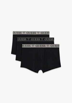 Mustad puuvillased bokserpüksid kolmekaupa, millel on hall vöörihm "GUESS" logoga. Sujuv tekstuur, tavaline lõige ja mustriteta.