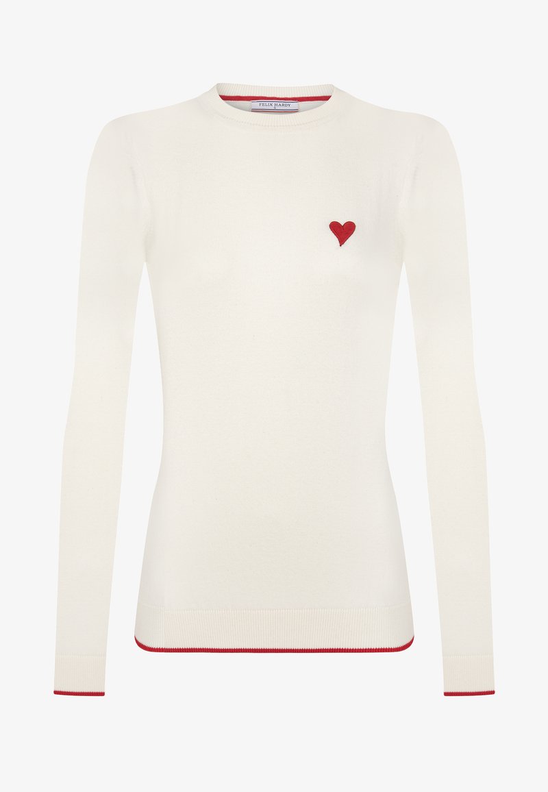 Biały sweter z długim rękawem z małym haftowanym czerwonym serduszkiem na piersi, czerwonymi paskami na mankietach i u dołu. Miękka dziana tkanina.