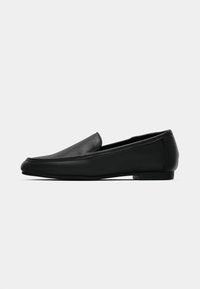 Black leather loafers with a smooth surface, rounded toe, and minimalistic design, featuring a low, flat heel and no visible hardware.