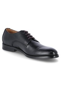 Scarpa di pelle nera con punta rotonda, sei fori per i lacci e una finitura liscia. Include un tacco basso e robusto.