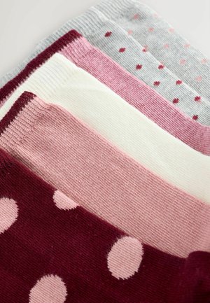 Komplet petih parov nogavic v odtenkih roza, krem in sive barve; z enobarvnimi in pikčastimi vzorci ter rebrastim robom na vrhu.