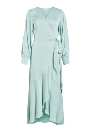 Robe portefeuille vert clair avec manches longues bouffantes, décolleté en V, détail de lien sur le côté et ourlet asymétrique à volants.