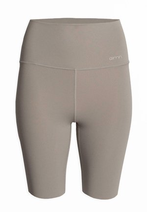 Höga cykelshorts i ett mjukt, taupe-färgat tyg. Har en slät yta med stickade detaljer och en liten logotyp på midjan.