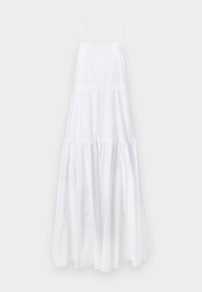 Λευκό χωρίς μανίκια φόρεμα με εφαρμοστό κορσέ, στρώσεις φούστας και λεπτή γυαλάδα. Διαθέτει ρυθμιζόμενα λεπτά λουράκια και συν gathered μέση.