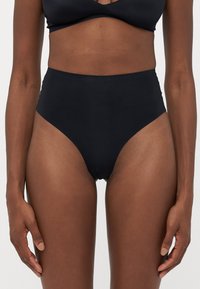 Black high-waisted bikini bottom with smooth, stretchy material and a high-cut leg design. Minimalist style, seamless finish, no visible hardware.