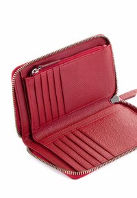 Red leather wallet with a zippered closure, multiple card slots, and a textured surface. Interior features a small zip pocket.