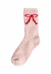 Calcetín difuso y rosa con una textura suave; presenta un lazo rojo bordado en la parte superior. Diseño de longitud hasta el tobillo con punta redondeada.