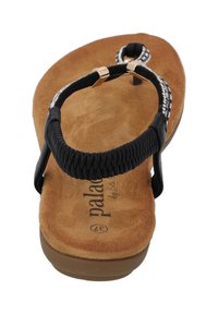 Infradito neri con cinturino intrecciato, dettagli metallici e soletta in suede color tabacco. Presentano una suola ammortizzata per il massimo comfort.