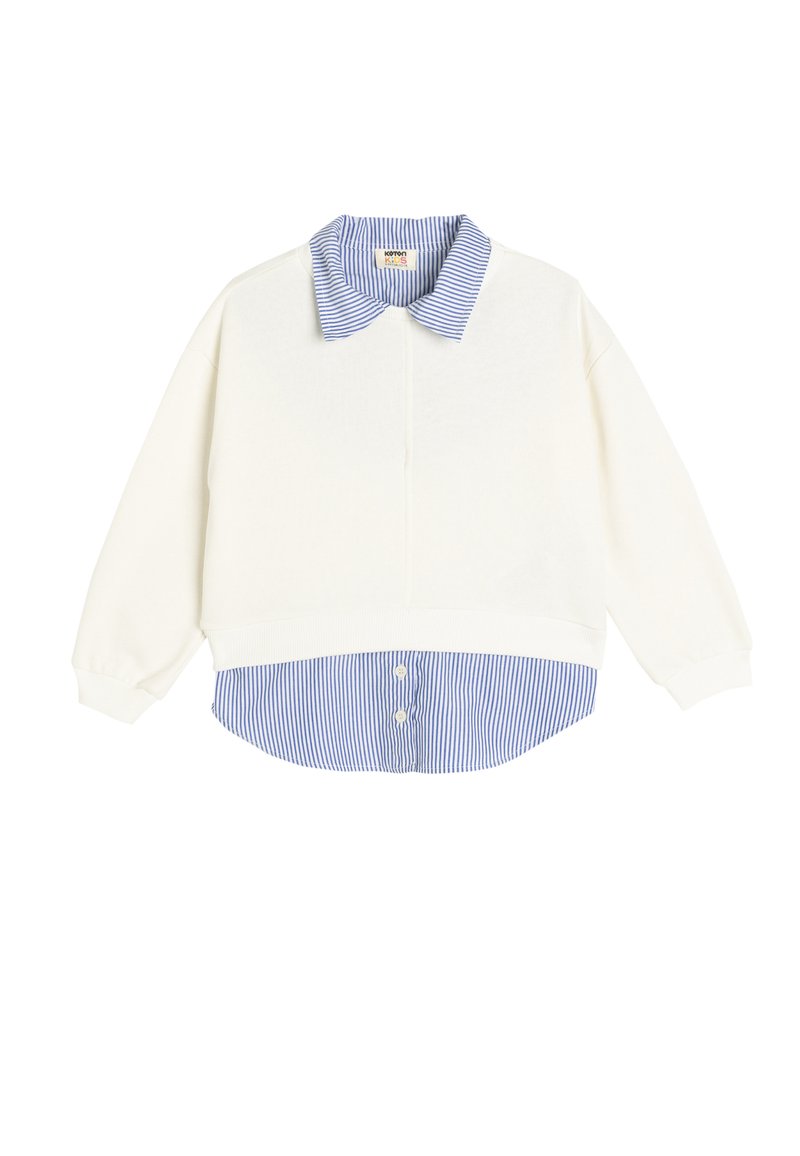 Felpa bianca con colletto a strisce blu e bianche, con maniche lunghe e un design a strati con dettaglio di bottoni all'orlo inferiore.