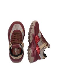 Sport shoes in red and beige hues with a textured upper, glittery accents, supportive sole, and contrasting laces. Features a Velcro strap.