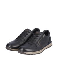 Scarpe in pelle nera con lacci e cerniera laterale, dotate di una suola beige e un accento marrone sul lato. Texture liscia e design a punta rotonda.