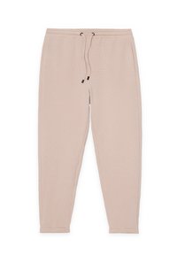 Pantalones jogger beige hechos de tela texturizada, con cintura elástica con cordones y puños estrechos en los tobillos.