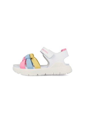 Sandalia blanca para niños con tiras anudadas en rosa, azul y amarillo y una tira de velcro en el tobillo sobre una suela blanca gruesa.