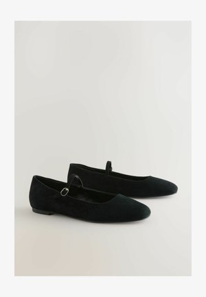 Black suede ballet flats with a rounded toe, a small ankle strap, and a flat sole. Finishing detail includes a metal buckle accent.
