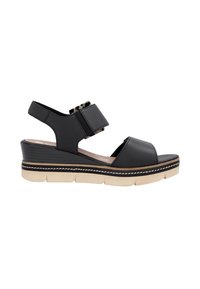 Sandale compensée en cuir noir avec de larges sangles, accents en imprimé léopard et semelle de plateforme beige texturée. Détails piqués le long du bord.