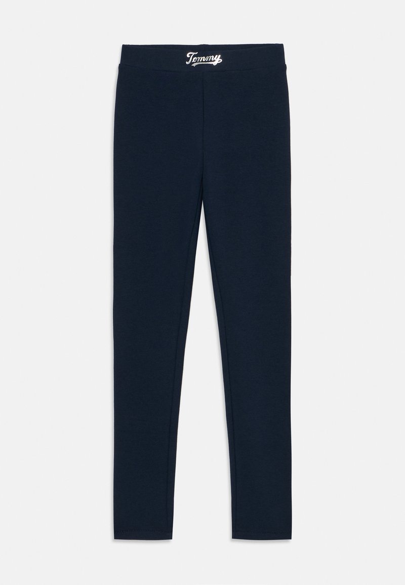 Μπλε μπλε κολάν από μαλακό ύφασμα, με φαρδύ λάστιχο στη μέση που έχει το λογότυπο "Tommy" σε λευκό χρώμα. Ο σχεδιασμός είναι κολλητός και έχει κανονικό μήκος.