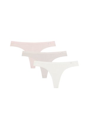 Trzy bezszwowe damskie stringi w jasnoróżowym, beżowym i białym kolorze, każdy z małą kokardą na gumce.