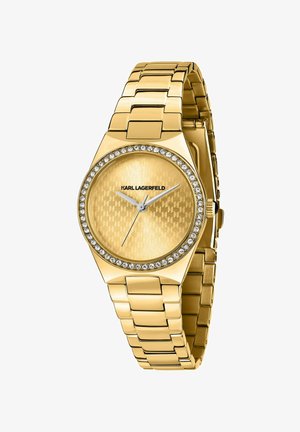 Orologio color oro con quadrante strutturato, dettagli in cristallo intorno alla lunetta e bracciale in acciaio inossidabile con design elegante e geometrico.