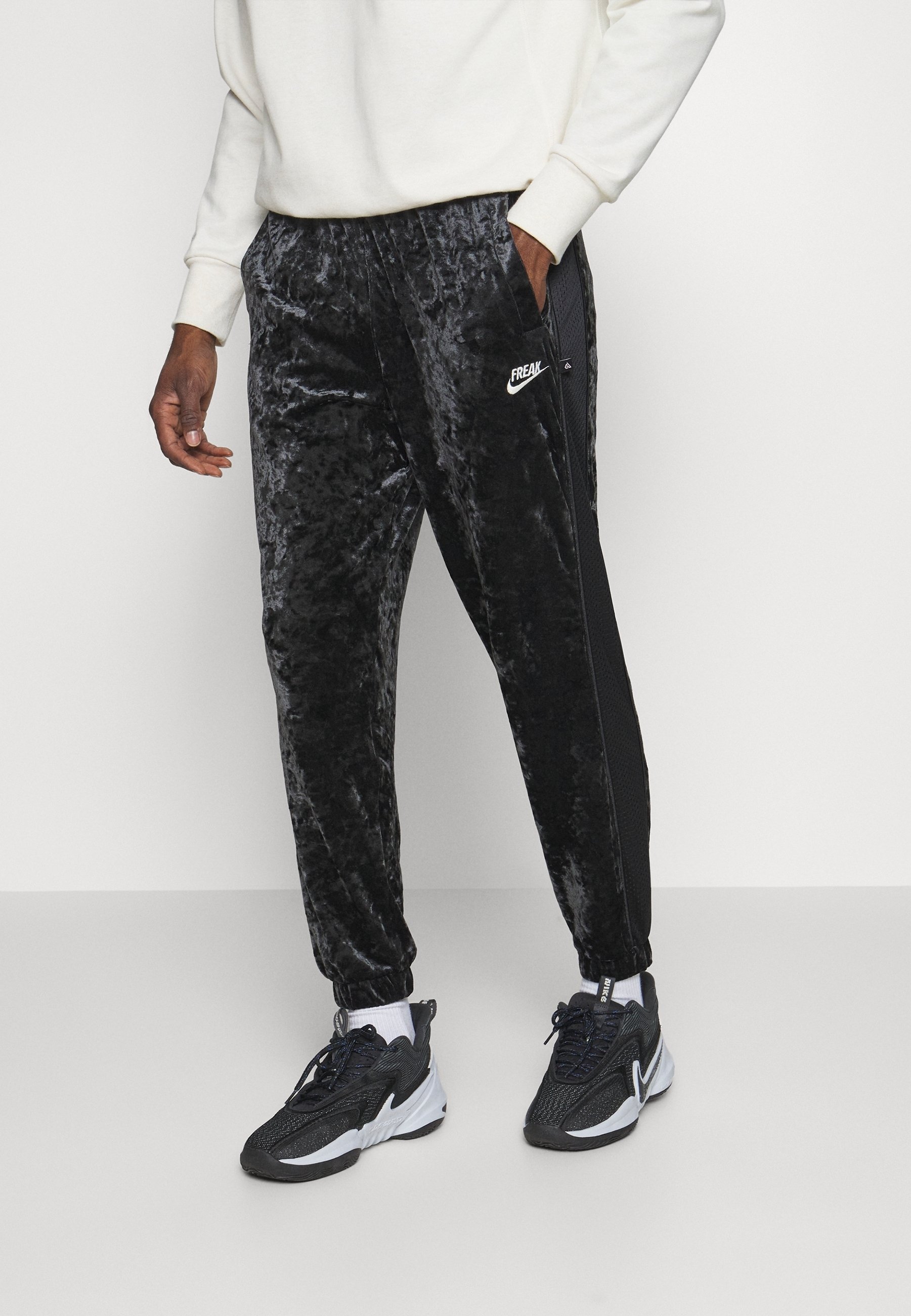 nike freak track pants