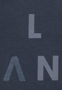 Navy blue T-shirt fabric featuring large light gray abstract letters "L," "A," and "N" in varying shapes. Smooth texture, minimal design.