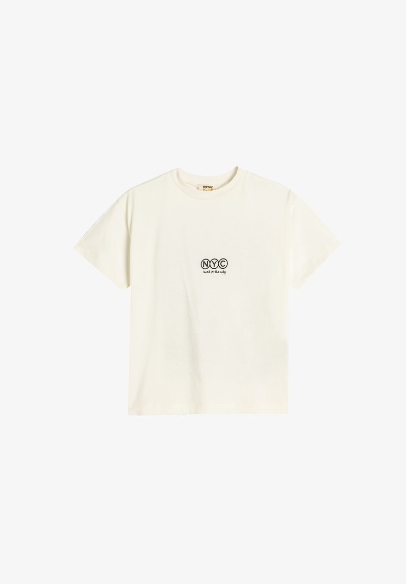 Cremefarvet bomulds T-shirt med korte ærmer, prydet med sort print "NYC" og teksten "bedst i byen" nedenfor. Rund hals, blød tekstur.