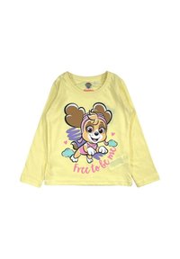 T-shirt à manches longues jaune avec un graphique de chien en cartoon aux oreilles marron et un bandeau rose, texte indiquant "Libre d'être moi". Mélange de coton doux.