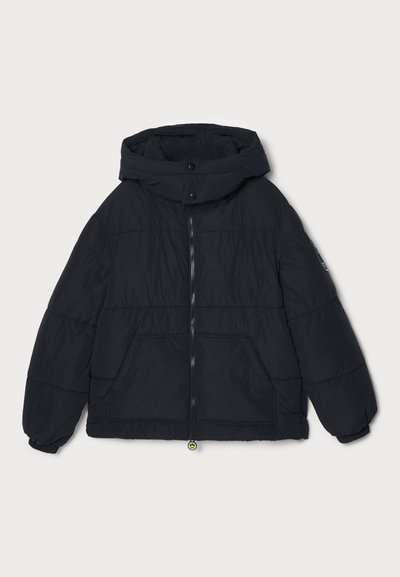 Padded black jacket with a hood, zipper closure, and two front pockets. Features stitched lines and a small green logo detail.