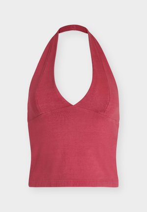 Red halter neck crop top with a deep V neckline and fitted waist, displayed against a plain light background.