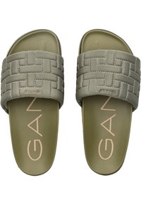 Infradito verdi con un design a strisce intrecciate, suola in gomma texture e branding in rilievo sulla soletta. Presentano una finitura opaca.