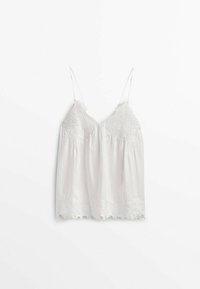 Camisole blanche sans manches avec délicate broderie en dentelle florale sur le corsage et l'ourlet, dotée de fines bretelles réglables.